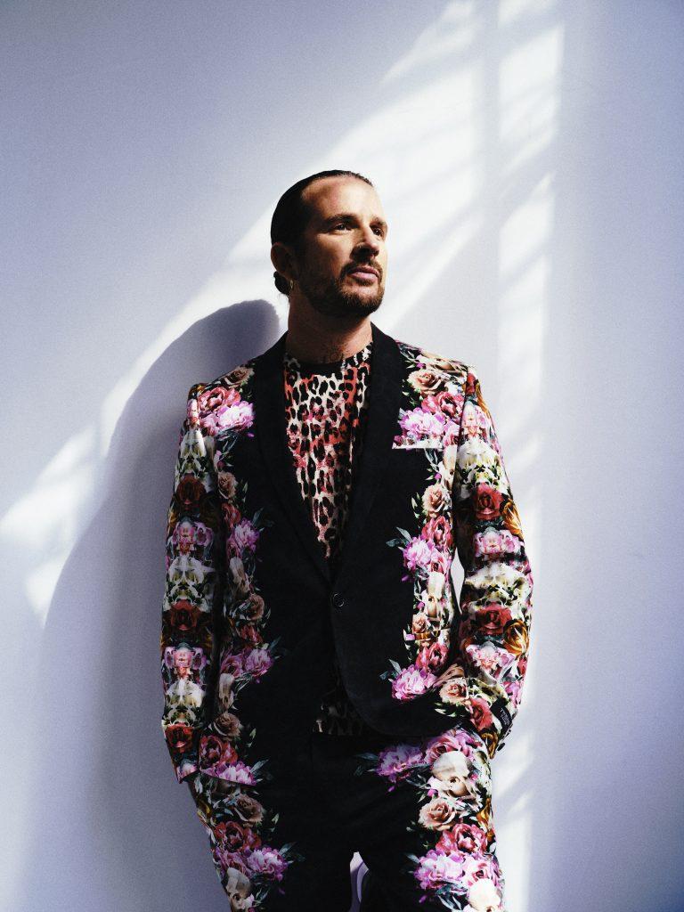 Lucien in a bright, floral suit