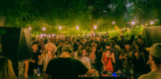 Sunday Sessions LA crowd under string lights at an outdoor party