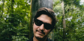 Ber Bonet in sunglasses among trees