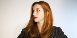 Trommel.256 – Tijana T Tijana T in a pinstripe blazer against a white background